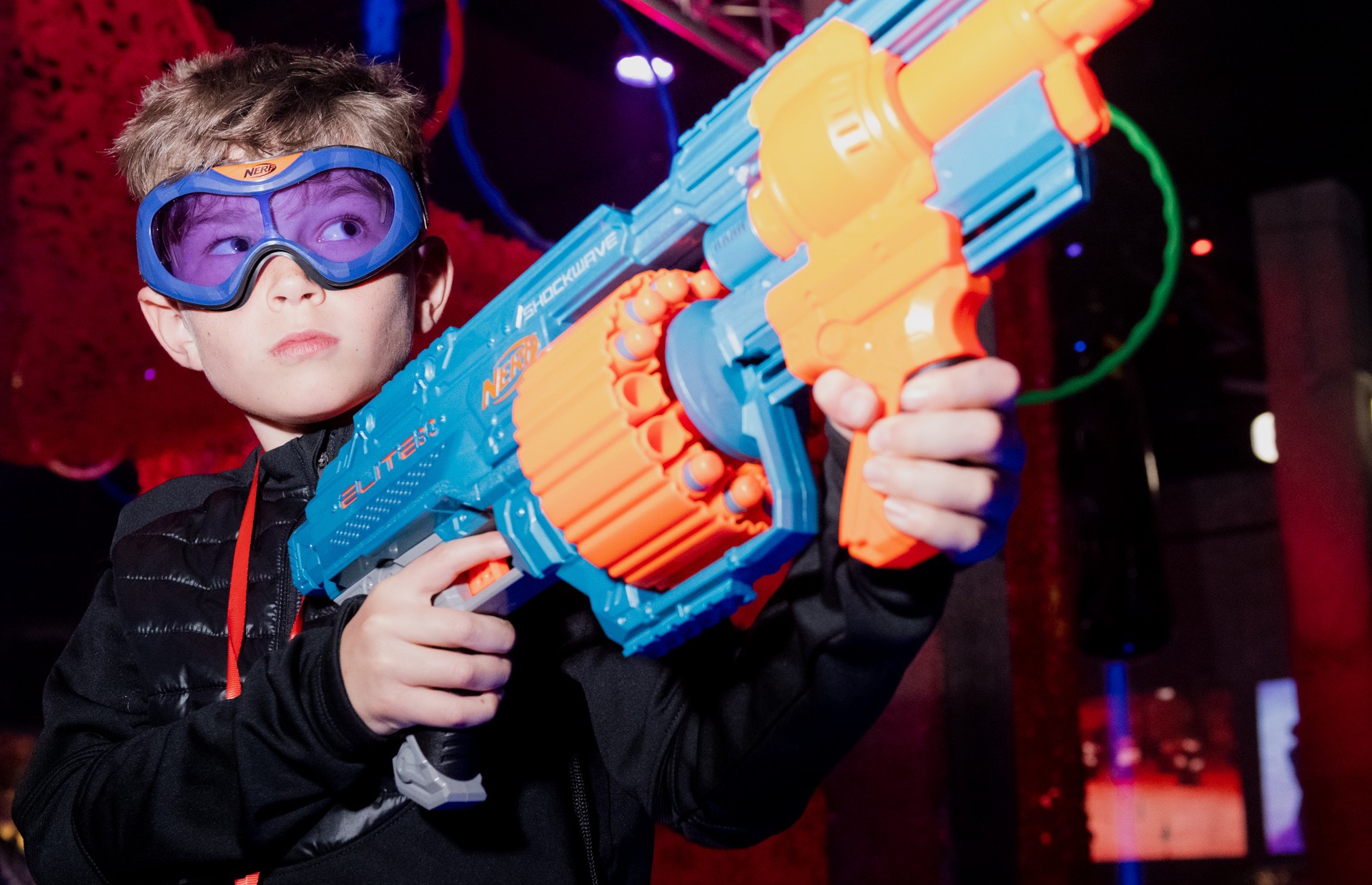 A boy holding a nerf blaster