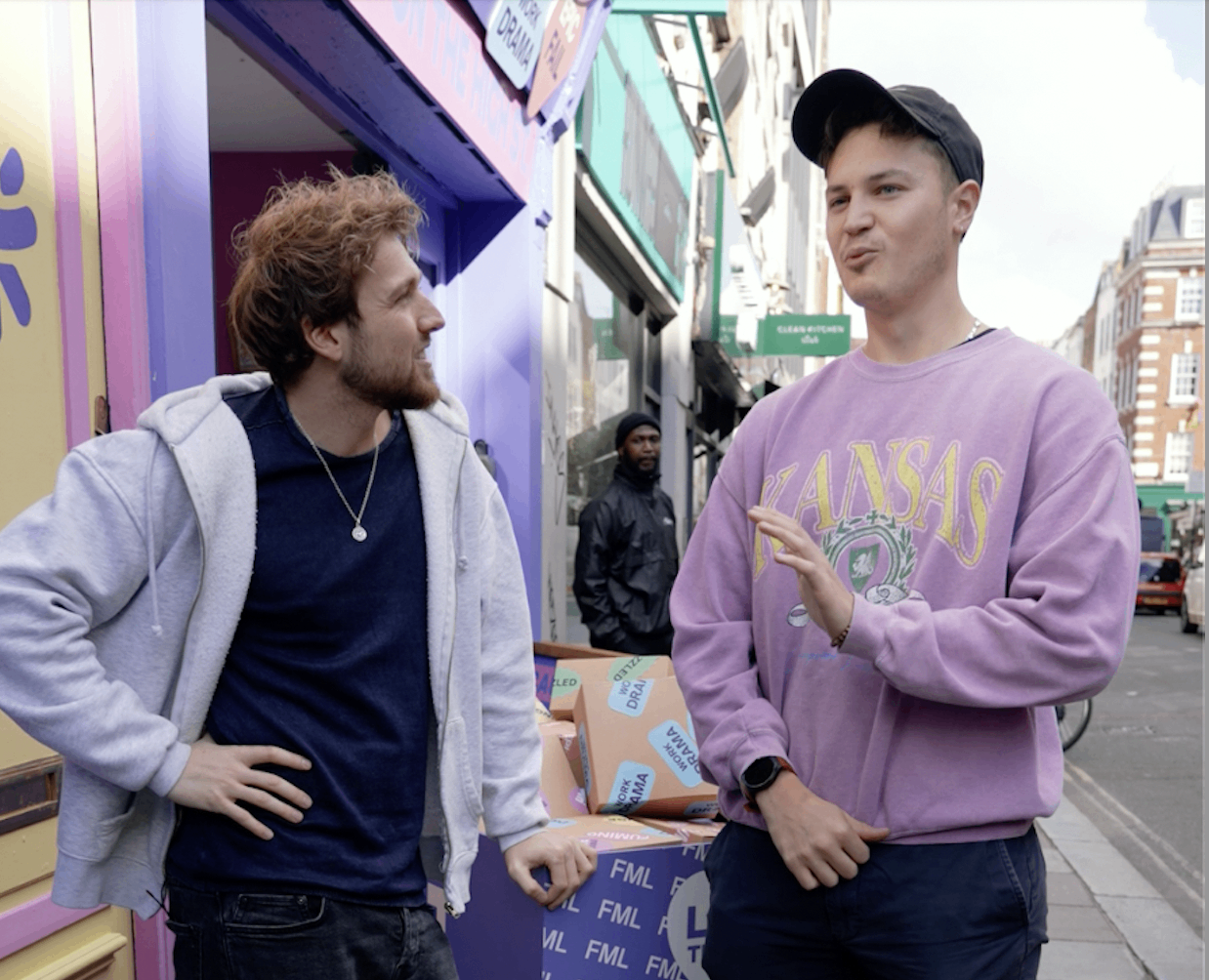 Two men talking outside the store