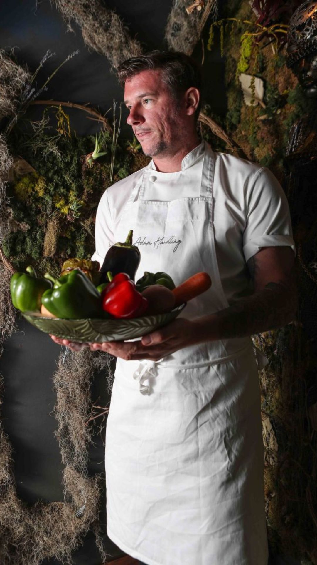 Adam Handling holding a bowl of food