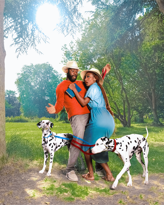 A couple with two Dalmatians