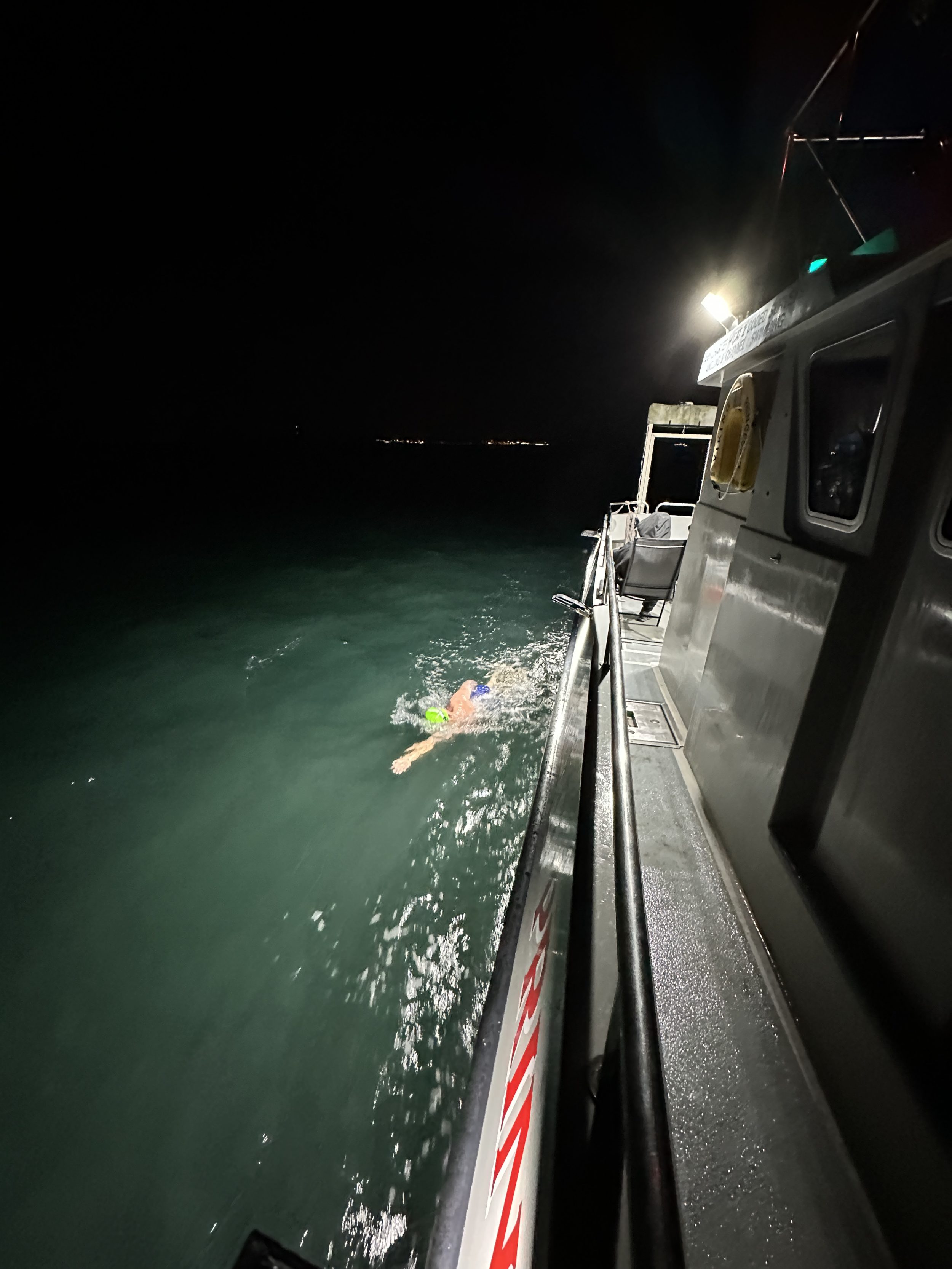 Swimmer by the boat