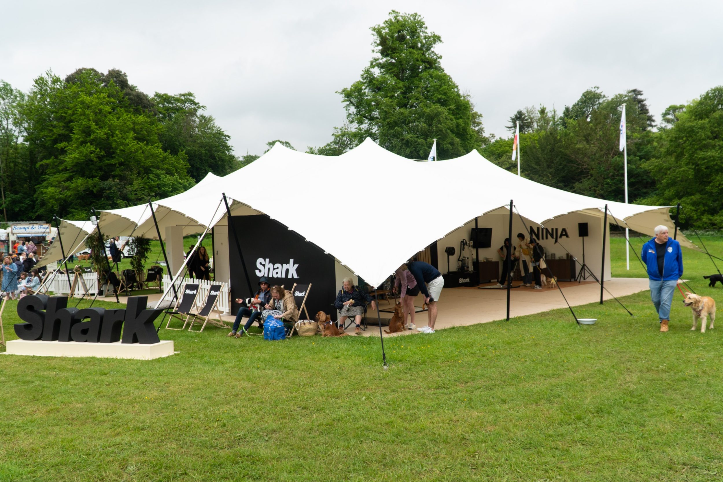A large SharkNinja tent in a field